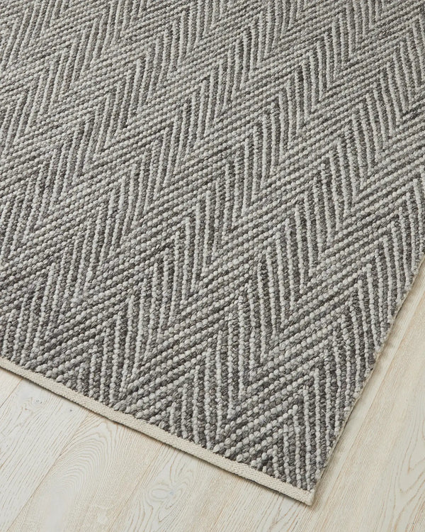 Zambesi Feather rug corner detail, 2m x 3m wool-blend chevron weave with cotton braided edge by Weave Home