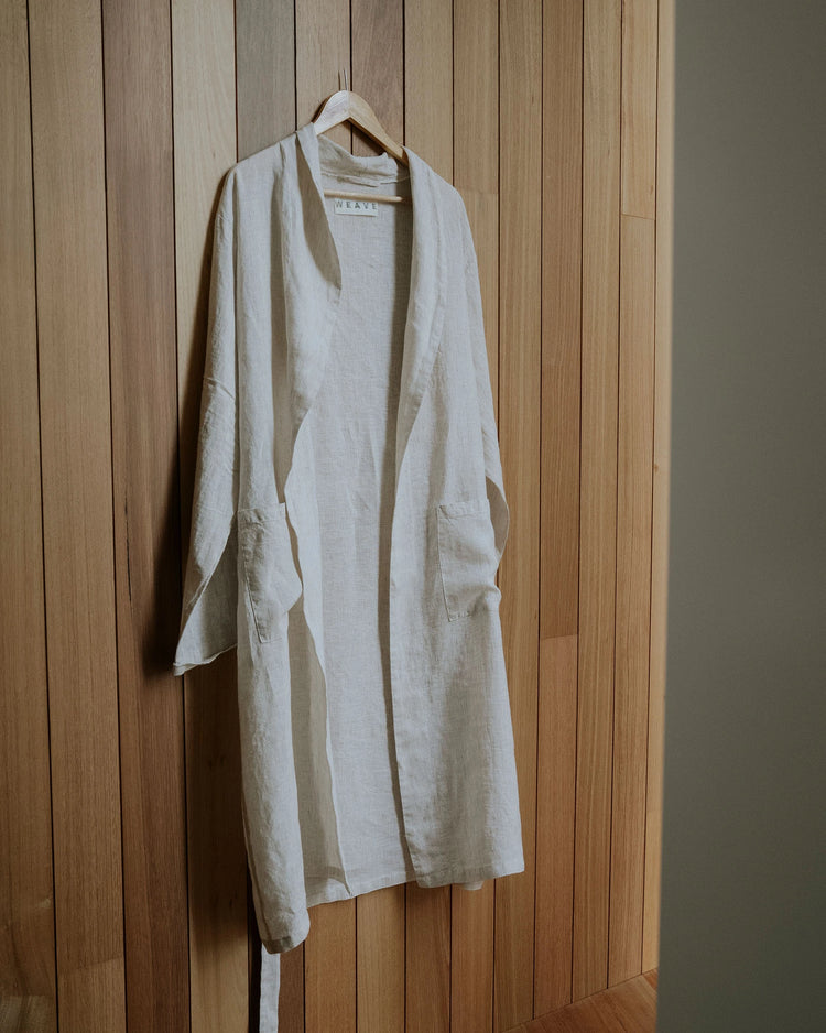 Sova Robe in Savanna, natural linen with subtle pinstripe weave and aero wash finish, displayed on hanger by Weave Home