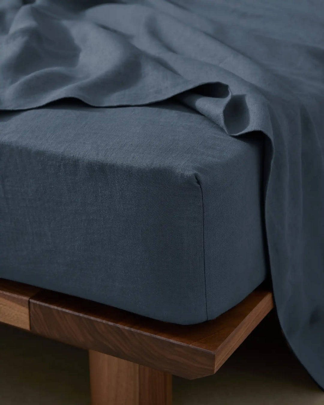 Ravello Fitted Sheet in denim European linen, close-up detail showing soft woven texture and deep fitted corner seam by Weave Home
