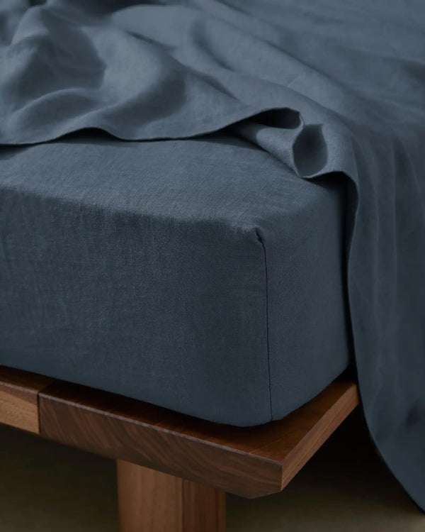 Ravello Fitted Sheet in denim European linen, close-up detail showing soft woven texture and deep fitted corner seam by Weave Home