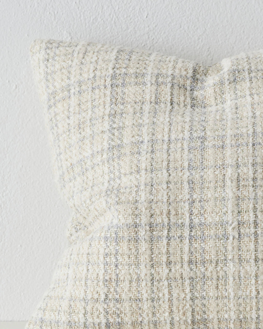 Tripoli Pearl 50x50 cushion close-up showing woven texture with white, sandstone and misty blue yarn variations by Weave Home