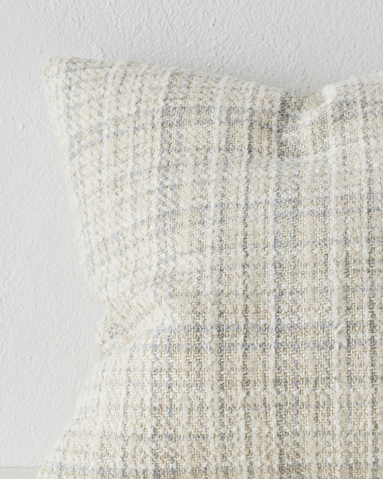 Tripoli Pearl 50x50 cushion close-up showing woven texture with white, sandstone and misty blue yarn variations by Weave Home
