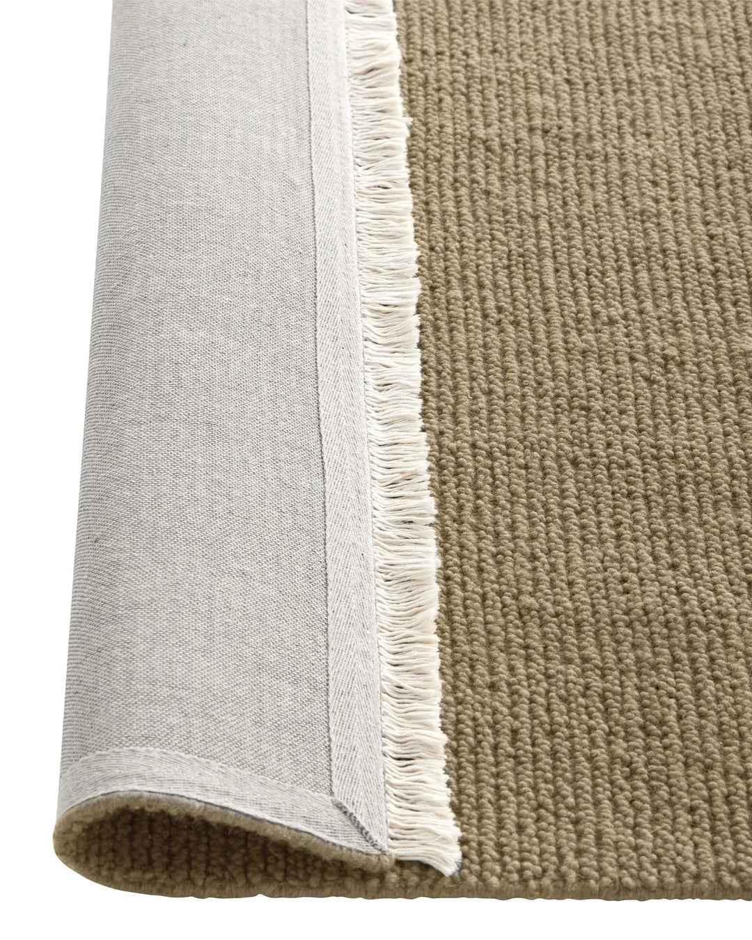 Fabien Nomad wool rug in sandy beige with chunky ribbed weave texture and cream fringe border, detail view by Weave Home