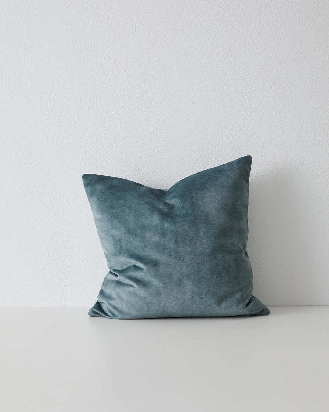 Ava Aqua cushion, 50x50cm, soft polyester velvet in cool-toned teal with relaxed folds, by Weave Home