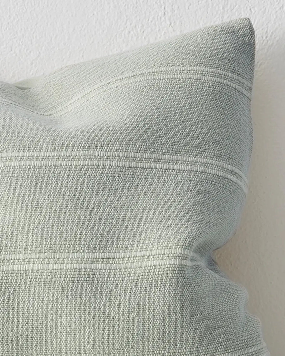 Palma Ice woven cushion detail, showing subtle ribbed cotton-linen blend texture and knife edge seam by Weave Home