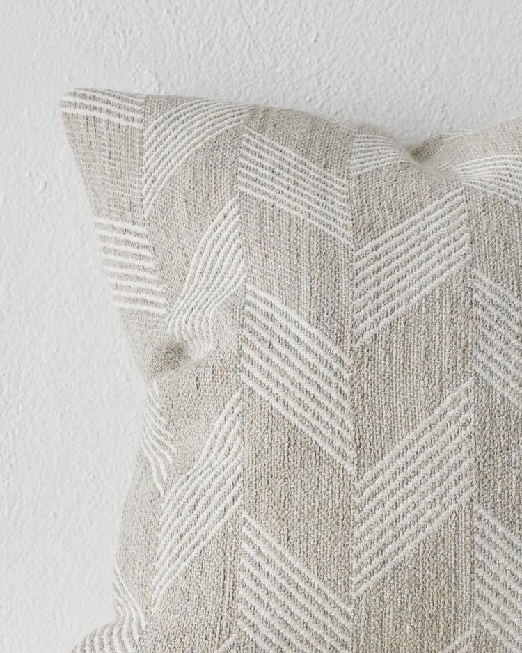 Riva Natural 50x50 linen cushion close-up, showing chevron weave texture and knife edge detail by Weave Home