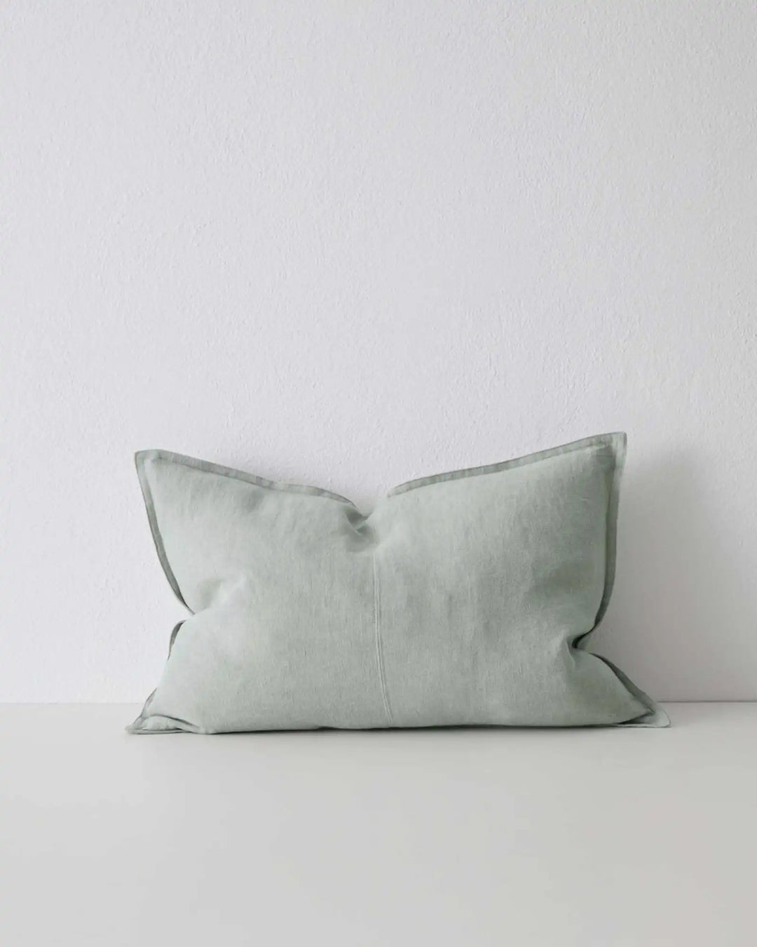 Como Laurel 40x60 eucalyptus green-grey linen cushion cover with piped edge detail by Weave Home