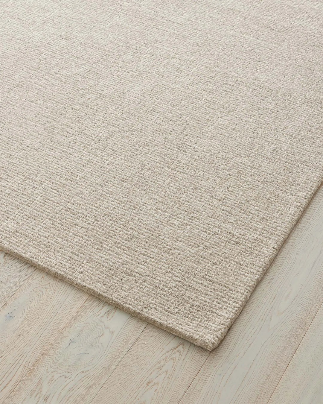 Kaia Moonbeam rug detail, showing textured contrast loop pile weave in natural NZ wool, 200x300cm by Weave Home