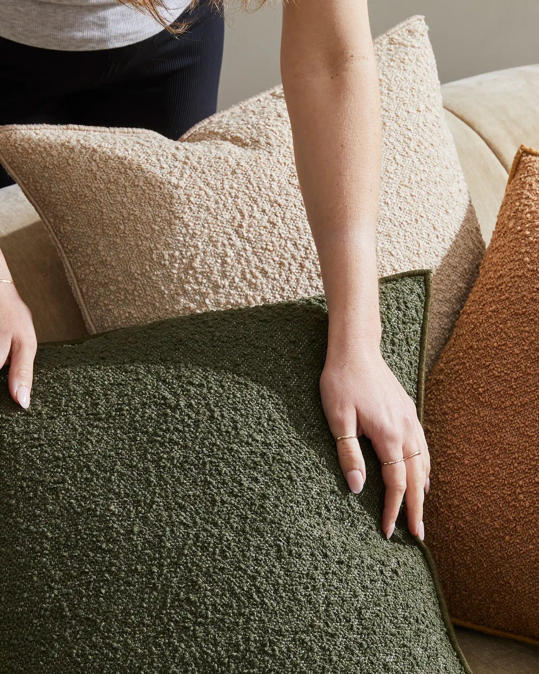 Alberto Olive bouclé cushion 50x50cm with soft-touch texture and babylock edge, styled with coordinating cushions by Weave Home