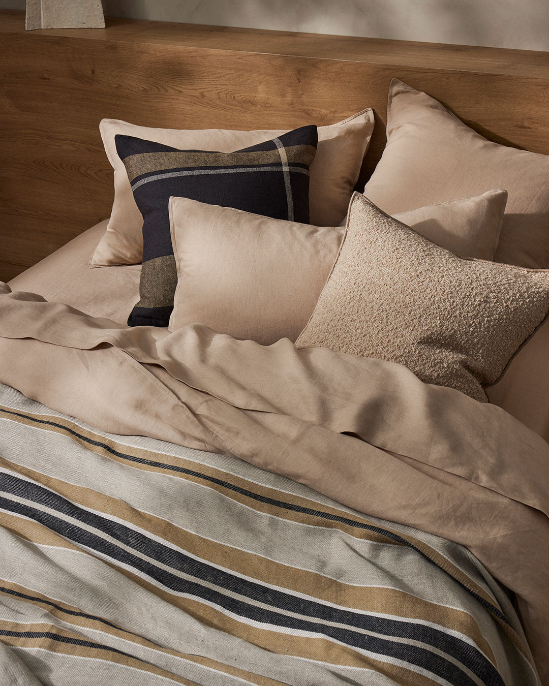 Ravello Flat Sheet in Shell, European linen, styled with navy and striped bedding by Weave Home