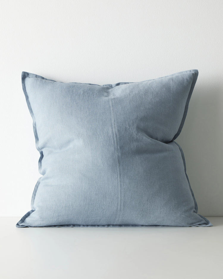 Como Horizon 60x60 linen cushion in light blue, front view showing piped edge detail, by Weave Home