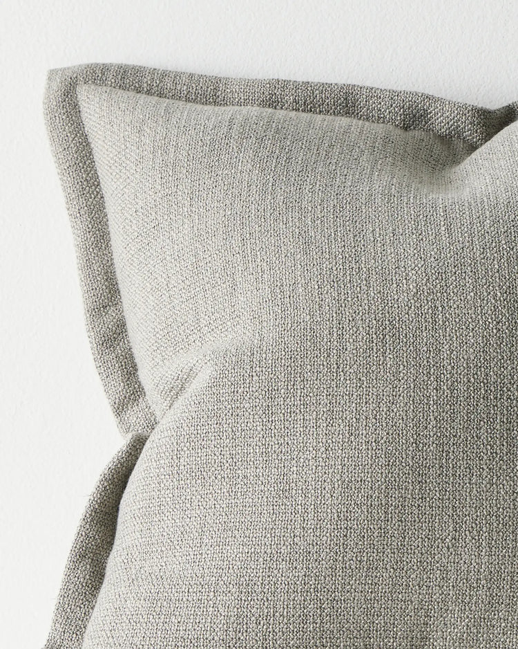 Figlio Fog 50x50 cushion cover detail, showing chunky woven polyester texture with piped edge seams by Weave Home