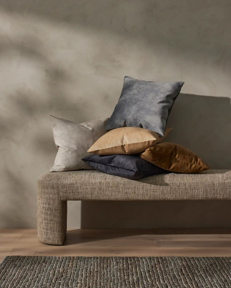 Suffolk Mineral jute rug in deep cool-toned brown with sage undertone, 200x300cm, styled with stacked cushions by Weave Home