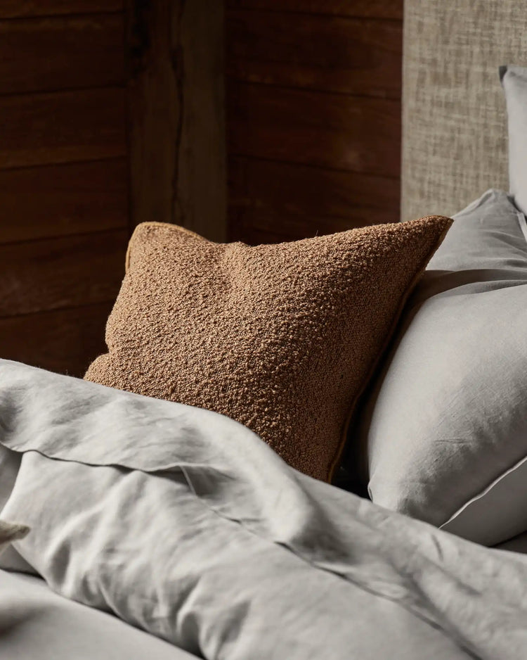 Alberto Copper bouclé cushion, 50x50cm, in rich copper with soft-touch texture and babylock edge, by Weave Home