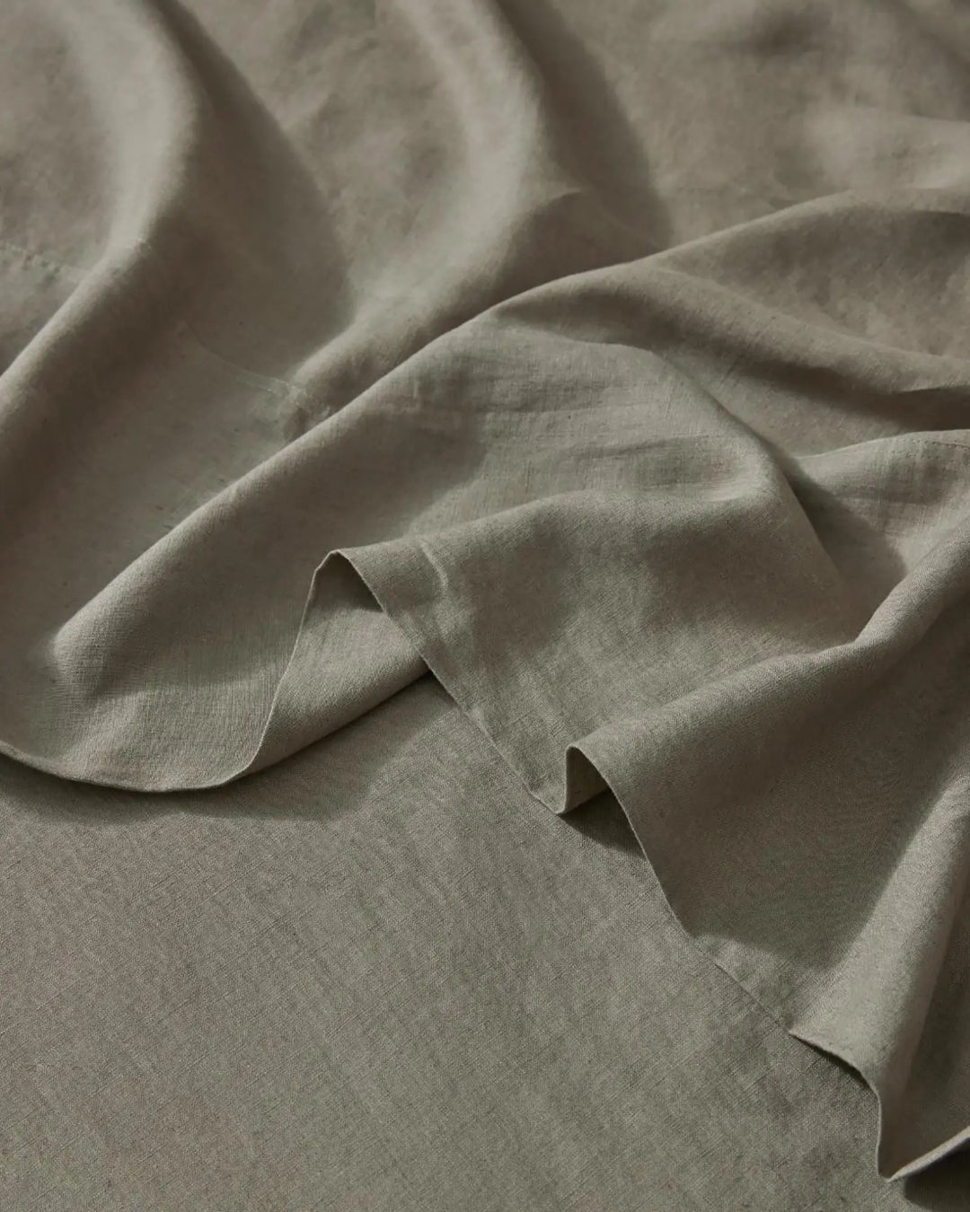 Ravello Flat Sheet in Caper, close-up detail of soft European linen weave with rolled selvage edge by Weave Home