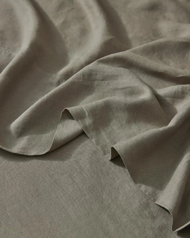 Ravello Flat Sheet in Caper, close-up detail of soft European linen weave with rolled selvage edge by Weave Home