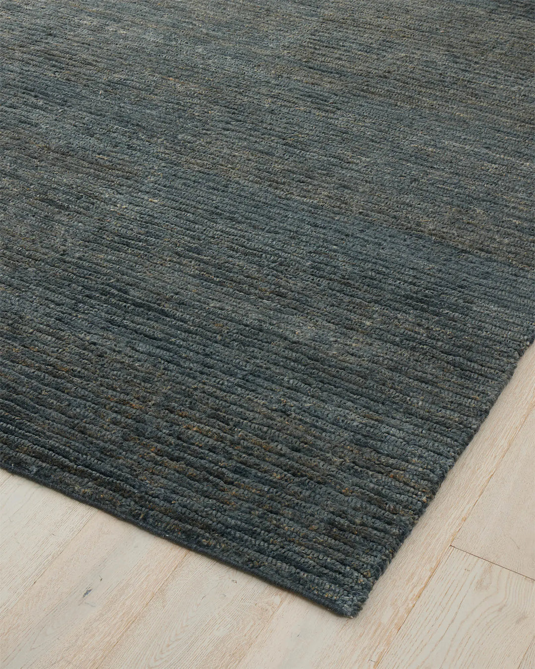 Bastian Dusk textured jute rug in charcoal blue, 200x300cm, with linear looped and cut pile detail by Weave Home