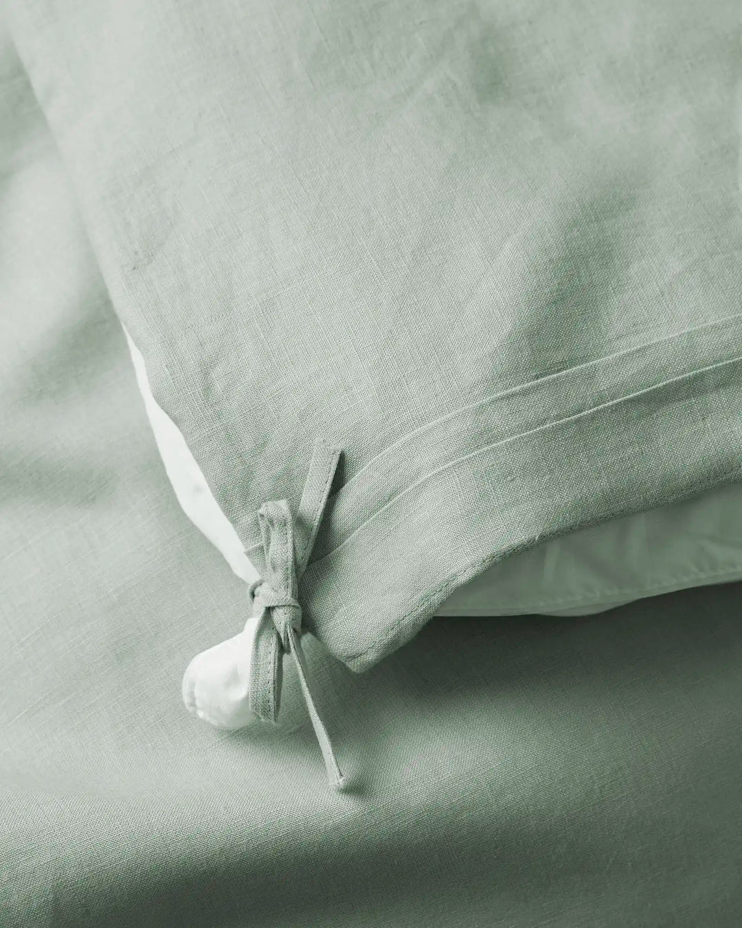 Ravello Quilt Cover in Sage, close-up of internal tie detail securing quilt, European linen by Weave Home