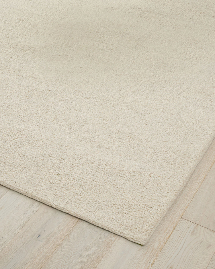 Marceau Angora wool-blend rug in cream, corner detail showing hand-woven texture, by Weave Home