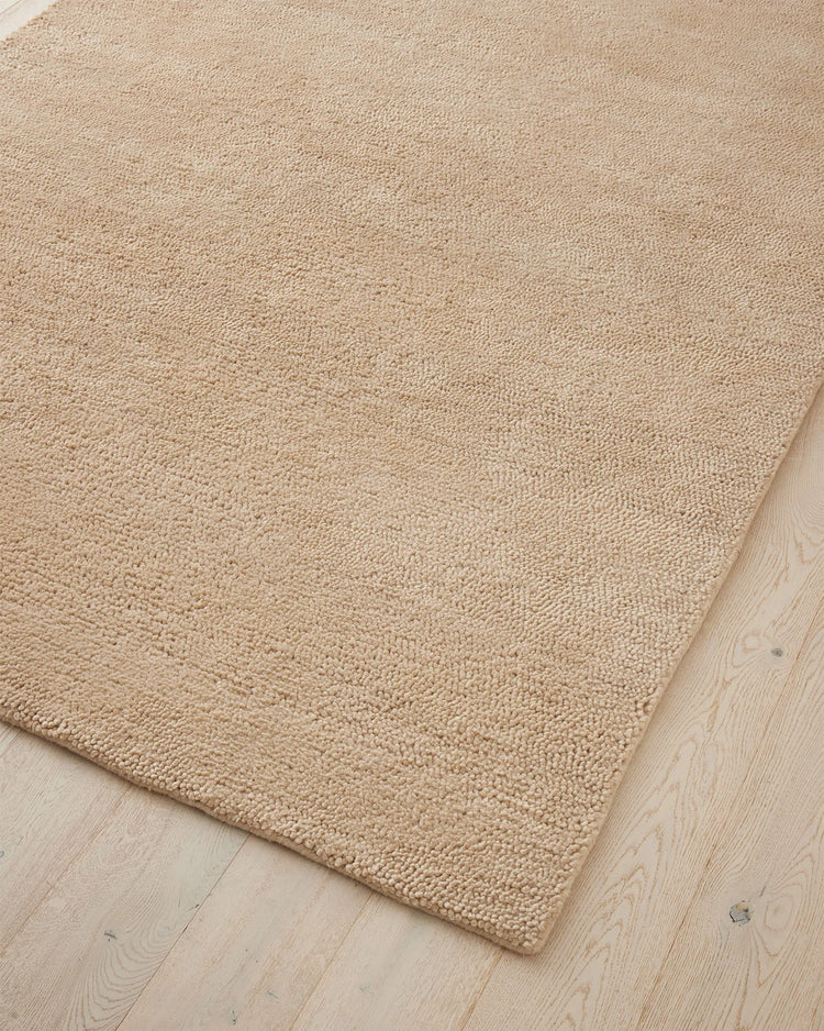 Valencia Dune rug corner detail, soft sandy beige chunky wool weave, high-traffic plush rug by Weave Home