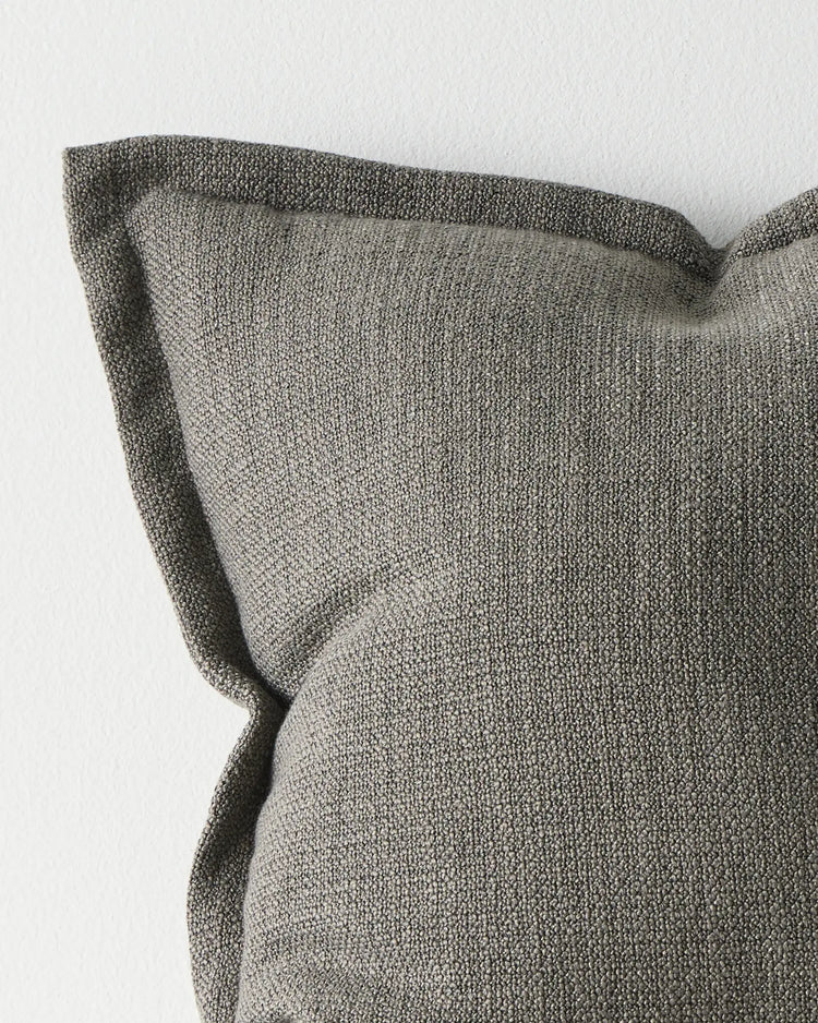Figlio Graphite cushion 50x50cm, close-up of chunky woven polyester texture in medium grey with tailored piping edge by Weave Home
