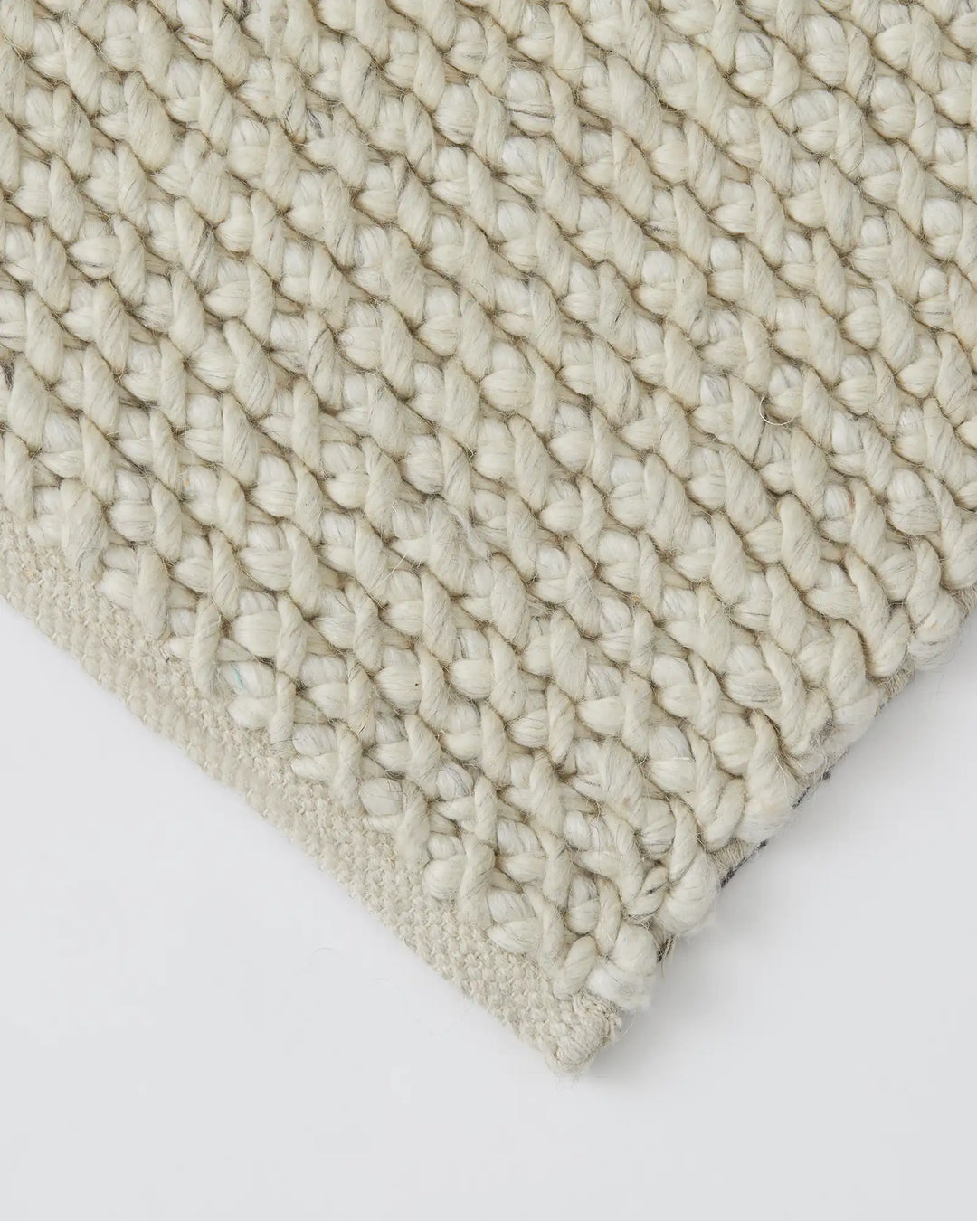 Emerson Seasalt rug detail view, showing thick woven NZ wool and viscose threads in warm off-white, textured low-traffic rug by Weave Home