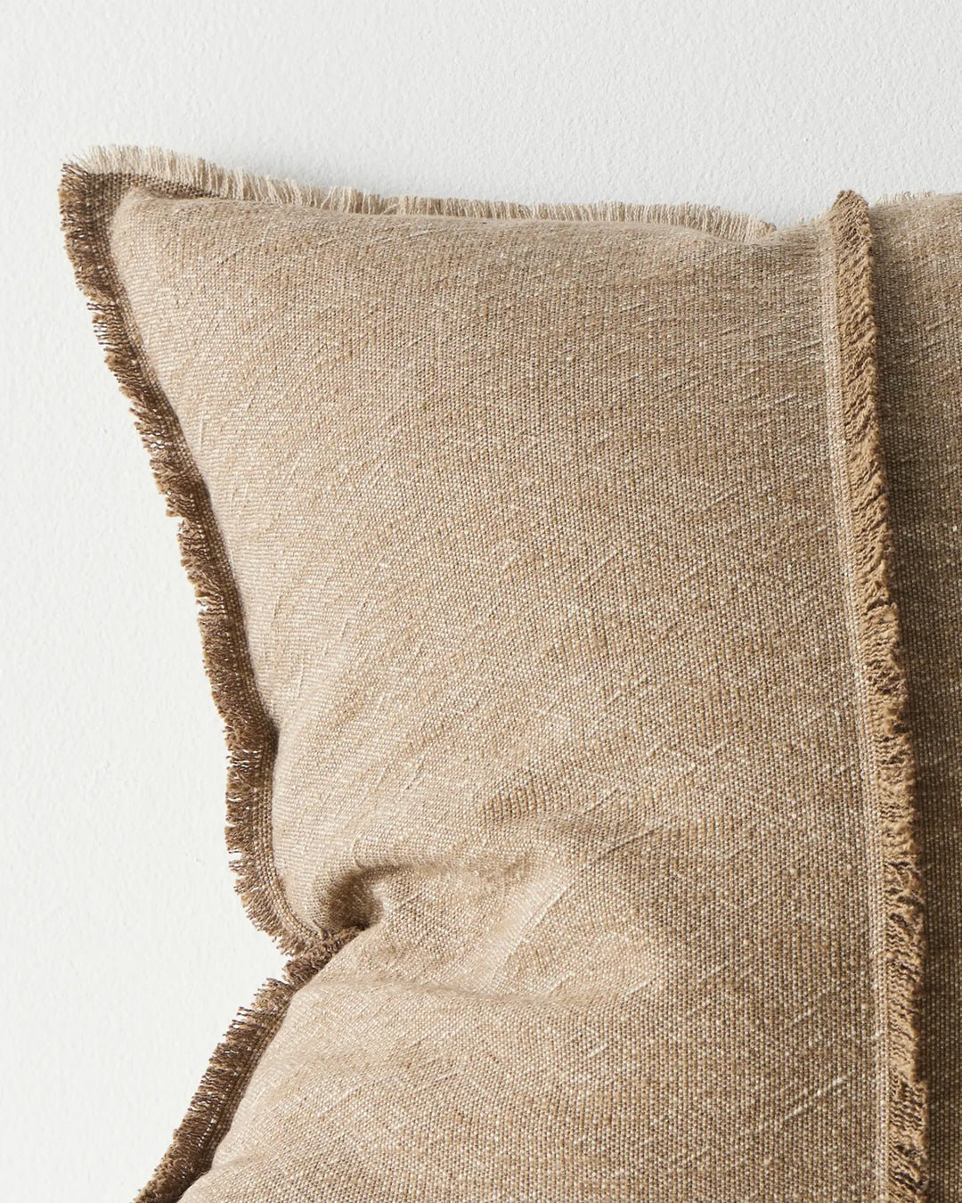 Adela Cocoa cotton linen cushion detail, showing raw-edge fringe border and textured weave close-up by Weave Home