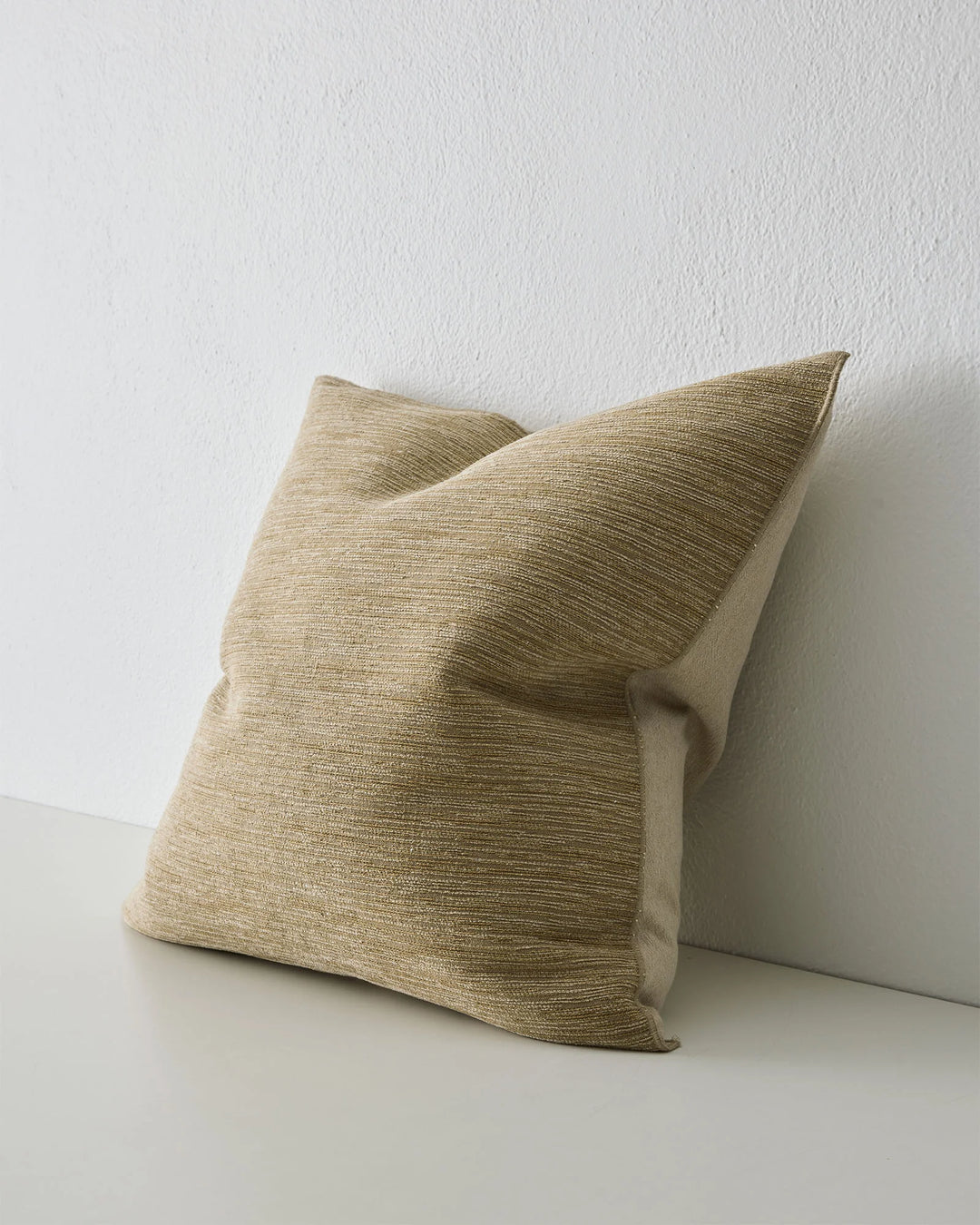 Dania Toffee 50x50 cushion with woven texture and warm metallic highlights, overlocked edges, side view by Weave Home