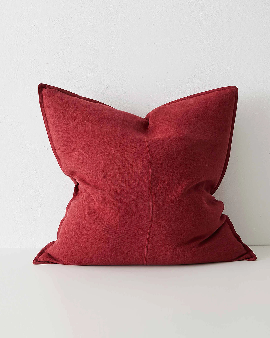 Como Rhubarb 60x60 cushion cover in vibrant red European linen with piping detail by Weave Home