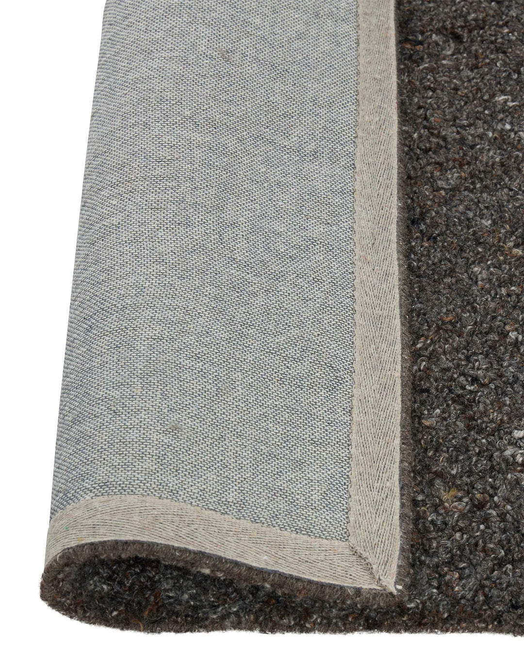 Marceau Chocolate wool blend rug detail, showing hand-woven texture with natural binding edge by Weave Home