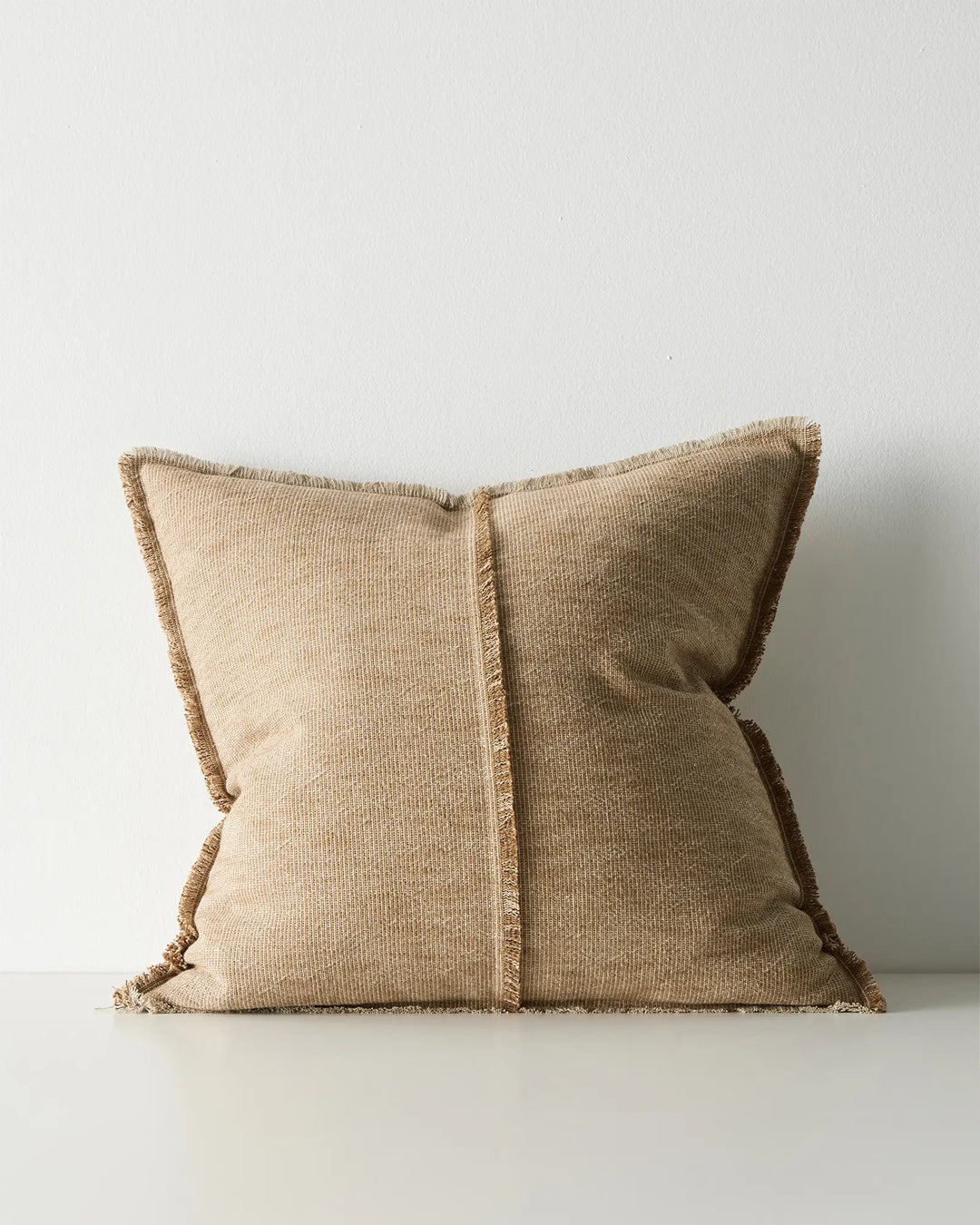 Adela Desert 50x50 cotton linen cushion with raw-edged fringe detail in sandy beige, front view by Weave Home