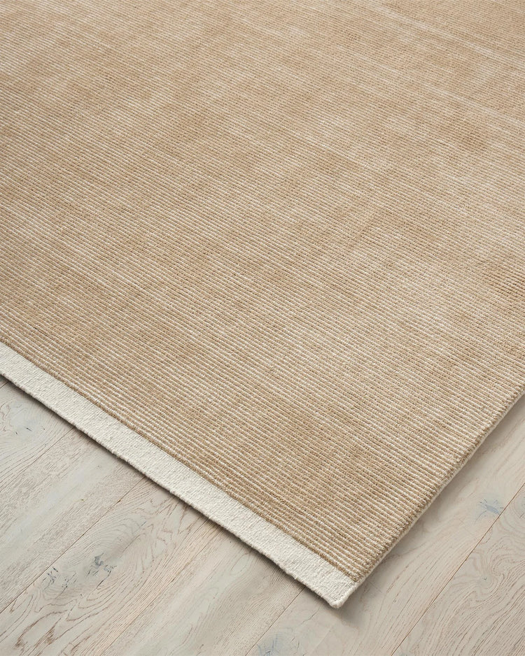 Remo Sand rug, hand-woven NZ wool with cream and taupe stripes, detail view showing textured weave and lowered cut border by Weave Home