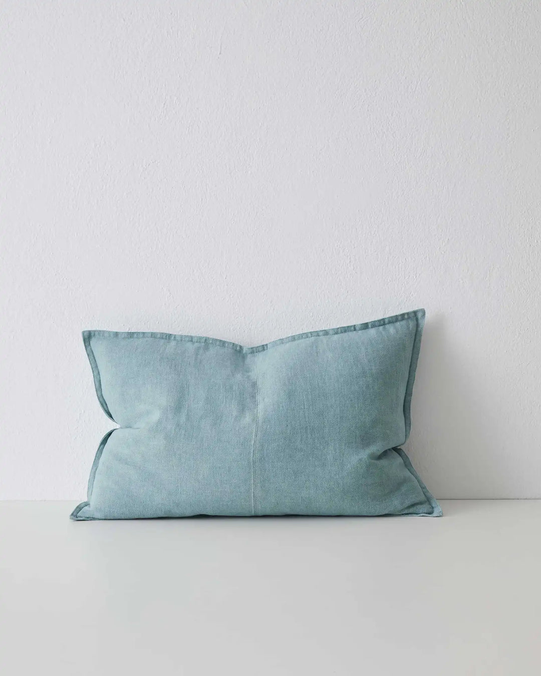 Como Mineral linen cushion 40x60cm in light blue with piping detail, front view by Weave Home