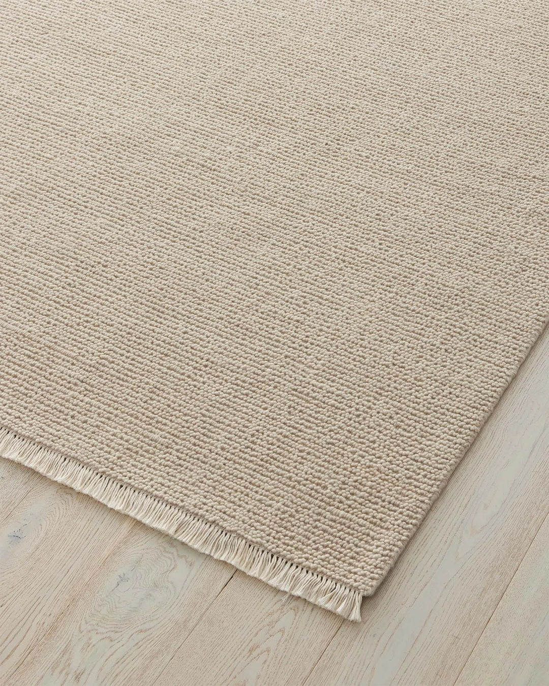 Fabien Stone textured wool rug, 200x300cm, chunky loop pile with cream fringe border detail by Weave Home