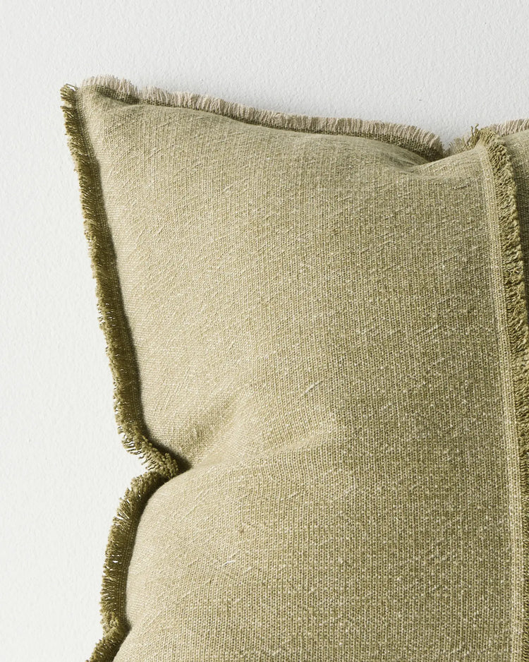 Adela Forest 50x50 cushion in muted olive cotton linen blend, close-up showing raw-edge fringe and textured weave by Weave Home