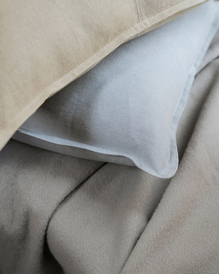 Como Haze cushion detail, soft light grey European linen with stone-washed matte texture, by Weave Home
