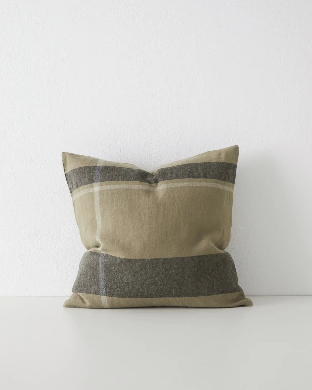 Dante Caper linen cushion in soft green placement check, 50x50cm, with charcoal and cream striped detail by Weave Home