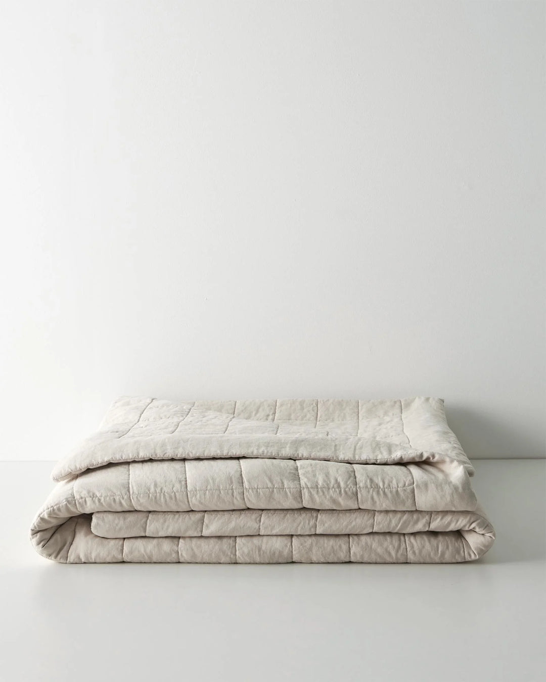 Ravello Coverlet in Bone, European linen with box quilt stitching and cotton-poly fill by Weave Home