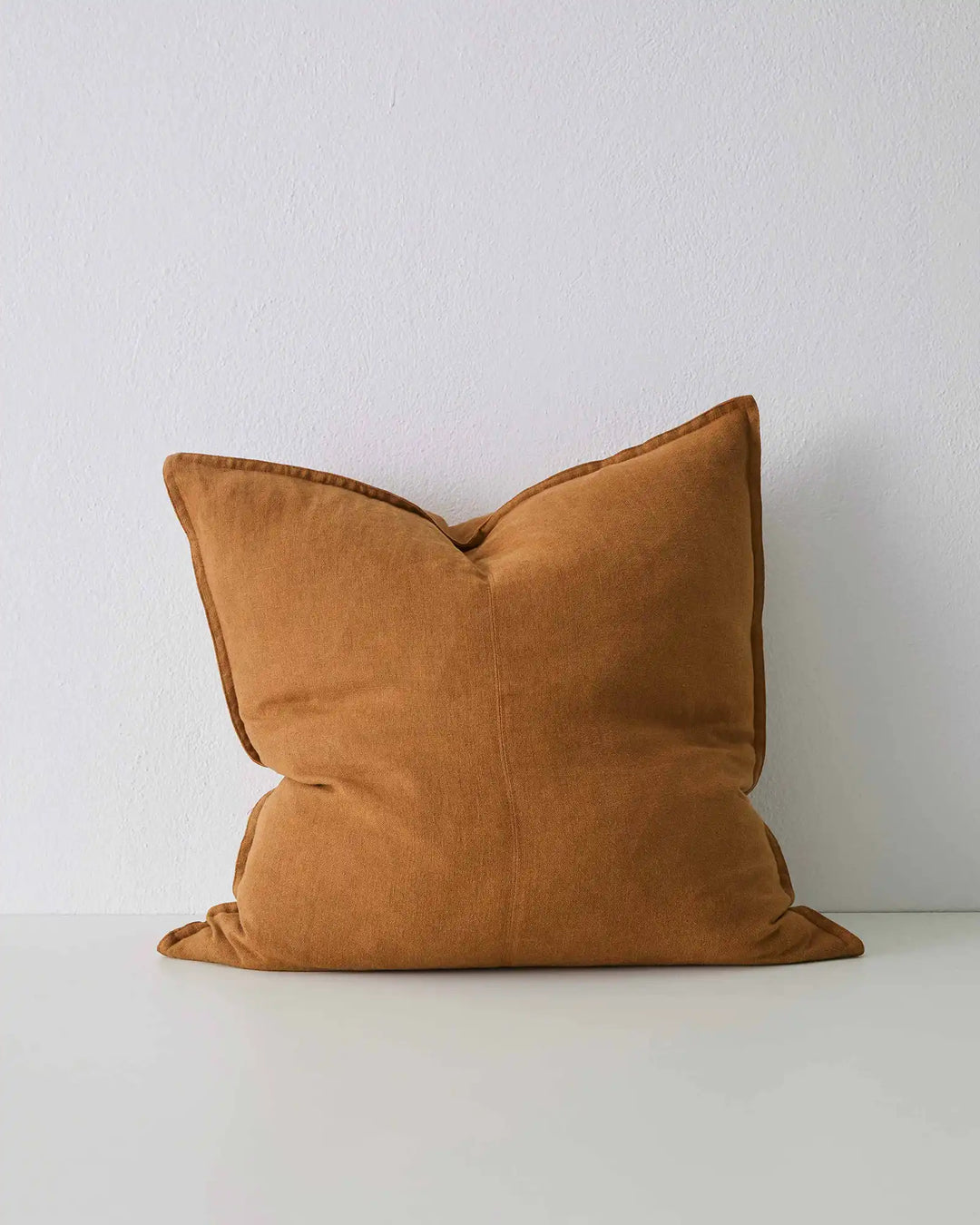 Como Spice 60x60 cushion cover in burnt orange linen with piped edges, front view by Weave Home