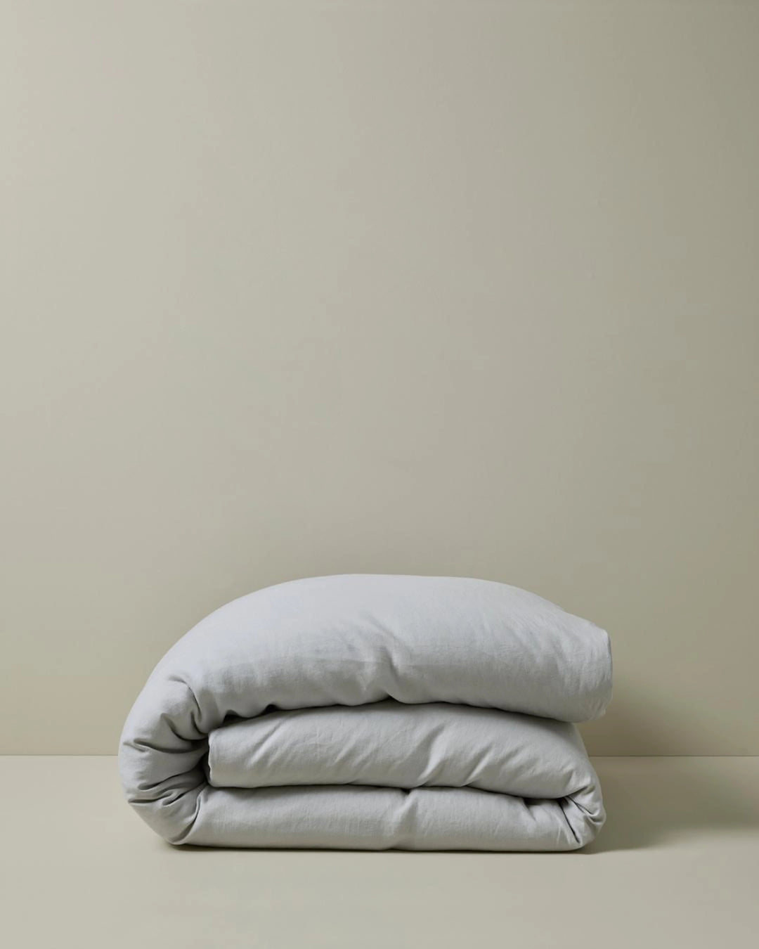 Ravello Quilt Cover in silver, folded to show the European linen fabric and relaxed texture by Weave Home