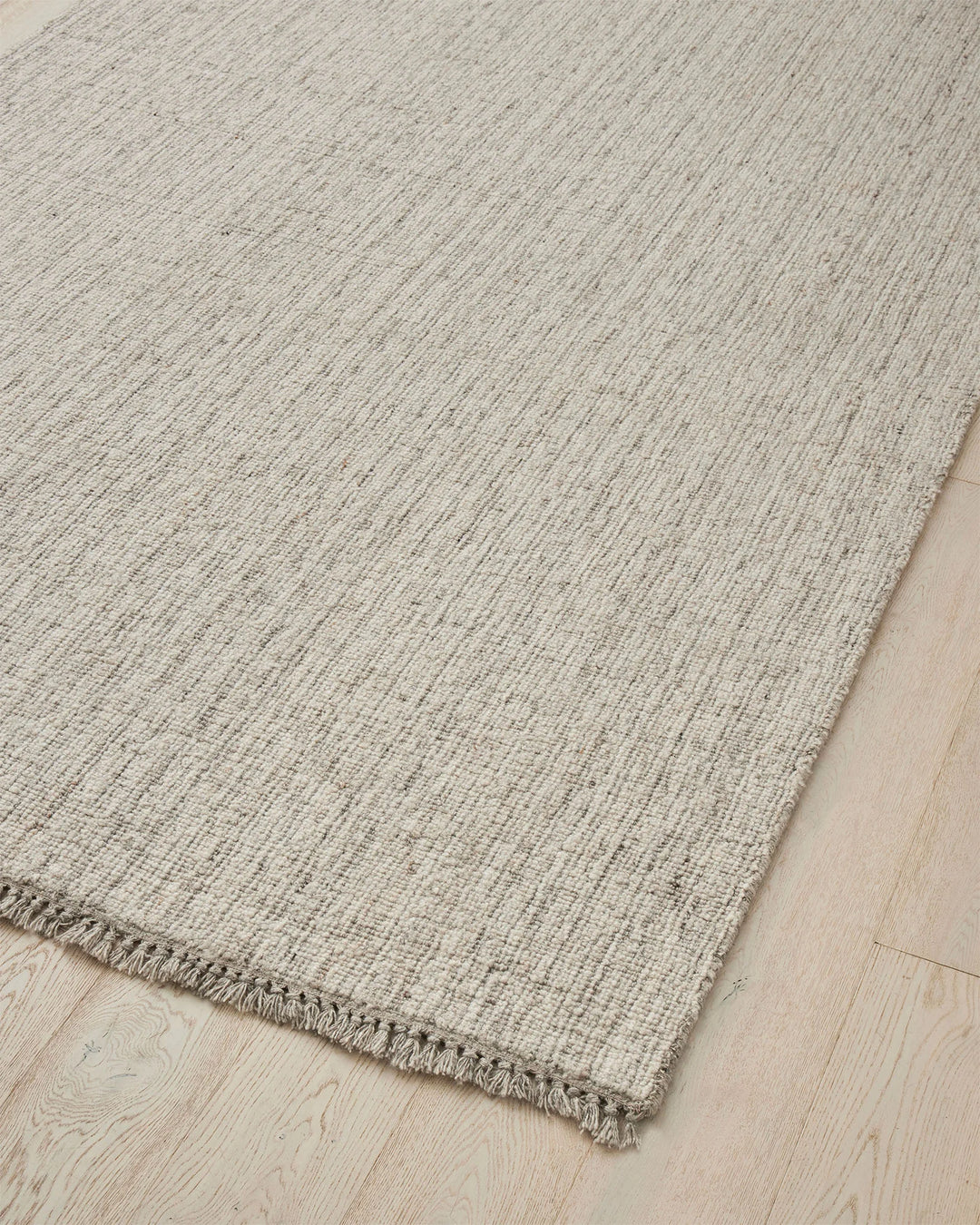 Puglia Fox textured woven rug in ivory with grey tones, chunky wool blend weave with fringe border, by Weave Home