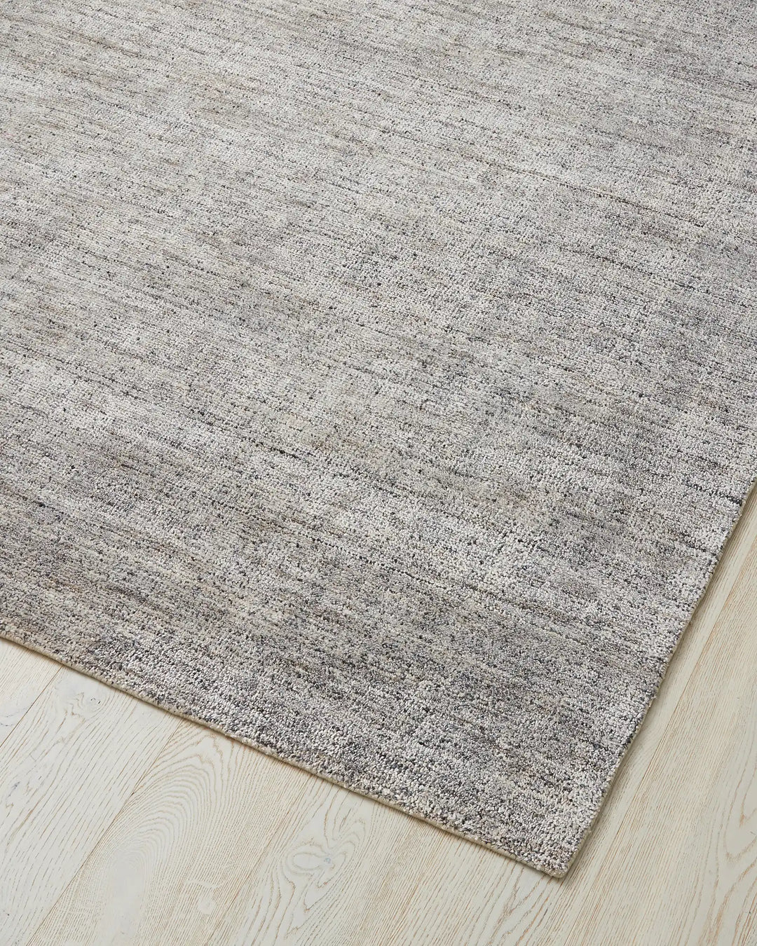 Granito Shale wool blend rug corner detail, hand-woven with soft bouclé texture, by Weave Home