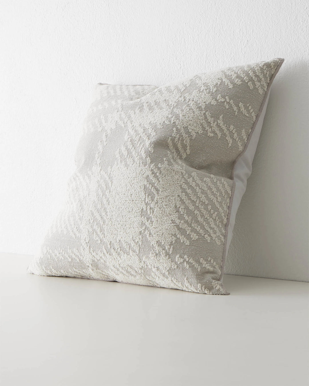 Sienne Moonbeam 50x50 cushion cover in light grey with oversized check weave texture and overlocked edge by Weave Home