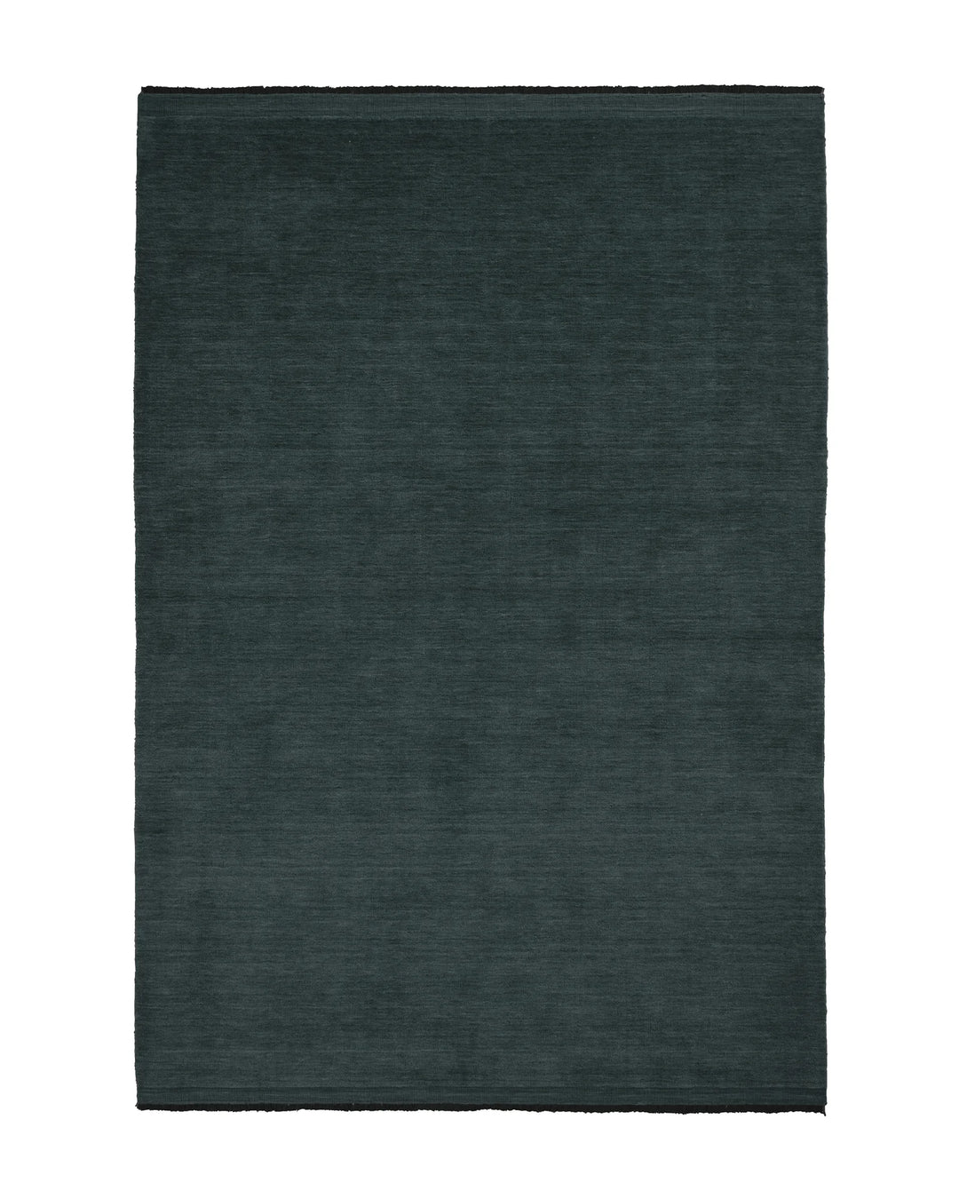 Silvio Dusk rug in deep muted blue with micro fringe border detail, sustainable hand-woven design by Weave Home