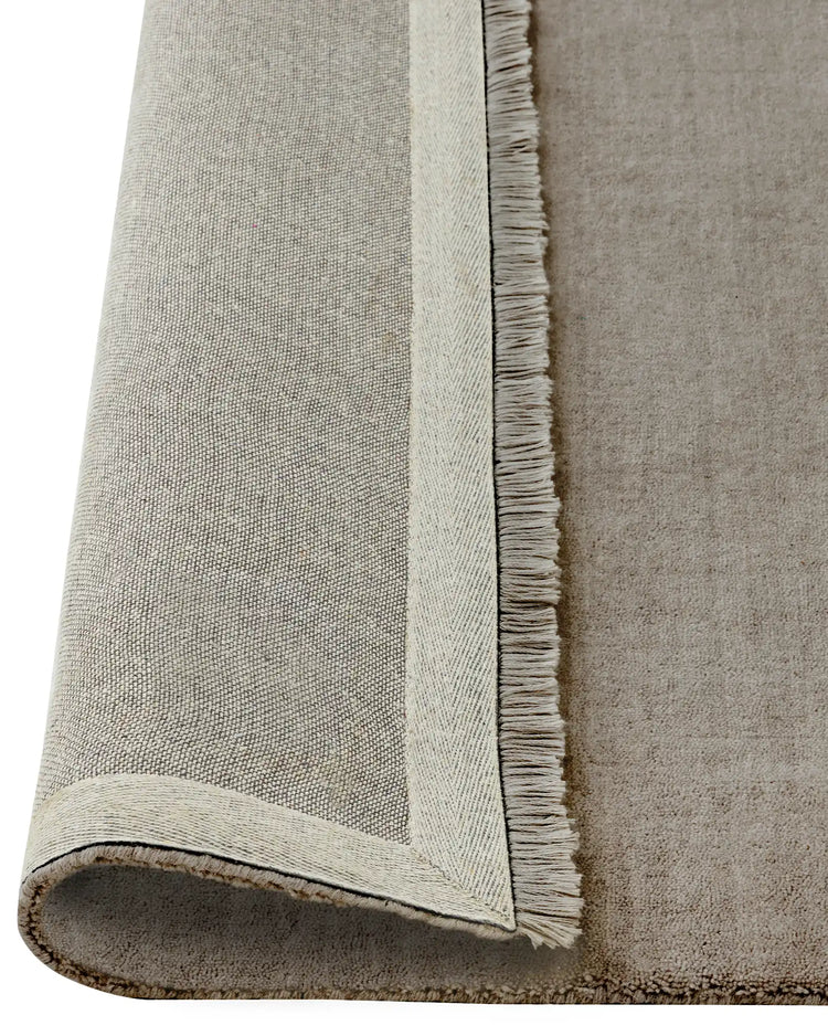 Silvio Flint rug detail, warm grey hand-woven sustainable styling with micro fringe border by Weave Home