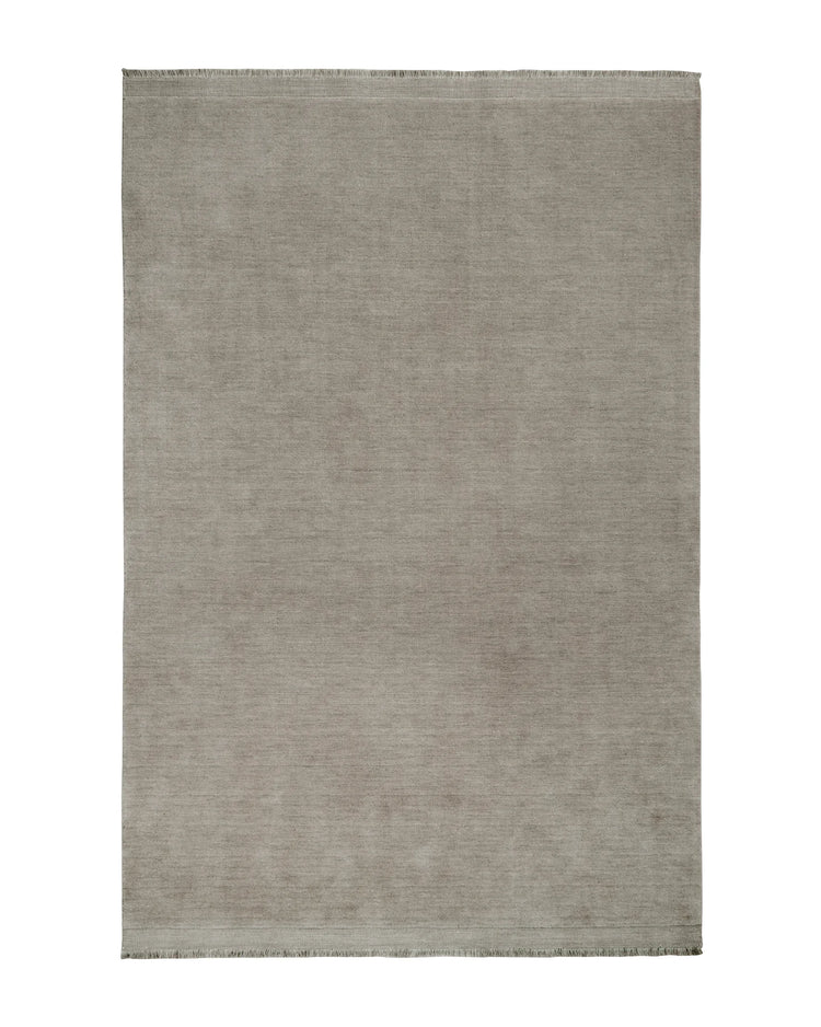 Silvio Flint hand-woven rug in warm grey with micro fringe border detail, sustainable styling by Weave Home