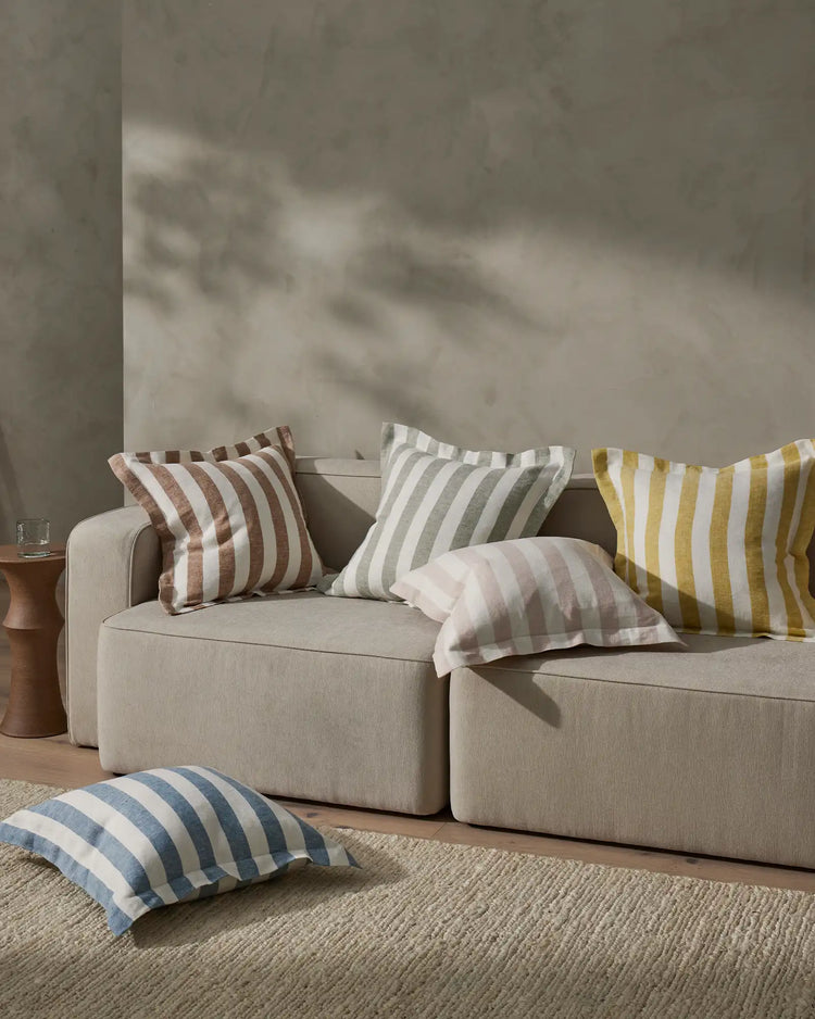 Vito Blush linen blend cushion with 4cm yarn-dyed stripe, 50x50cm, displayed on neutral sofa by Weave Home