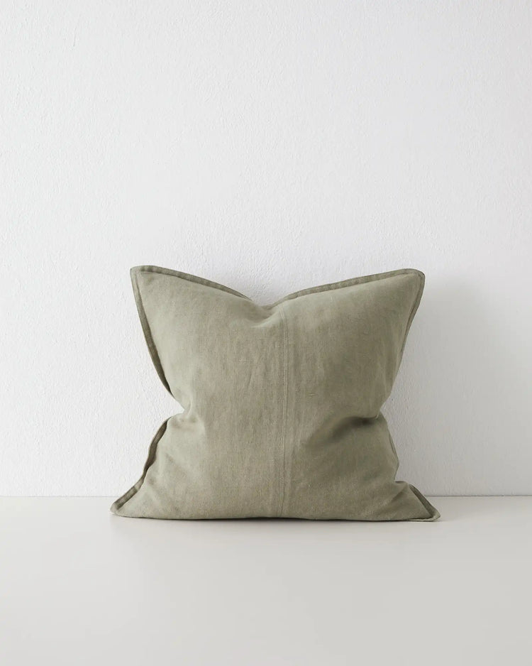 Como Caper 50x50 cushion cover in soft muted green linen with piped edges, front view by Weave Home