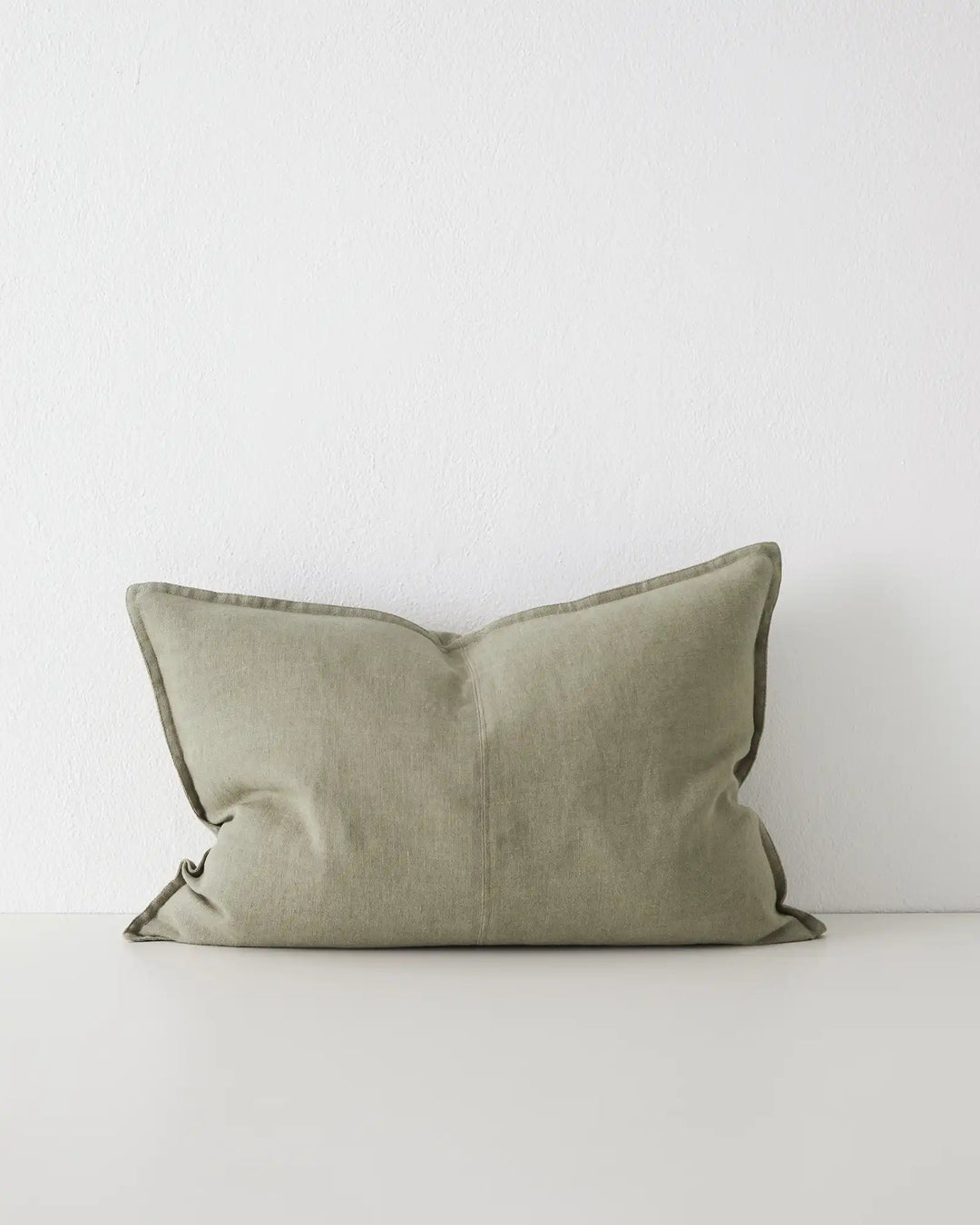 Como Caper linen cushion 40x60cm in soft muted green with contrasting piping, front view, by Weave Home