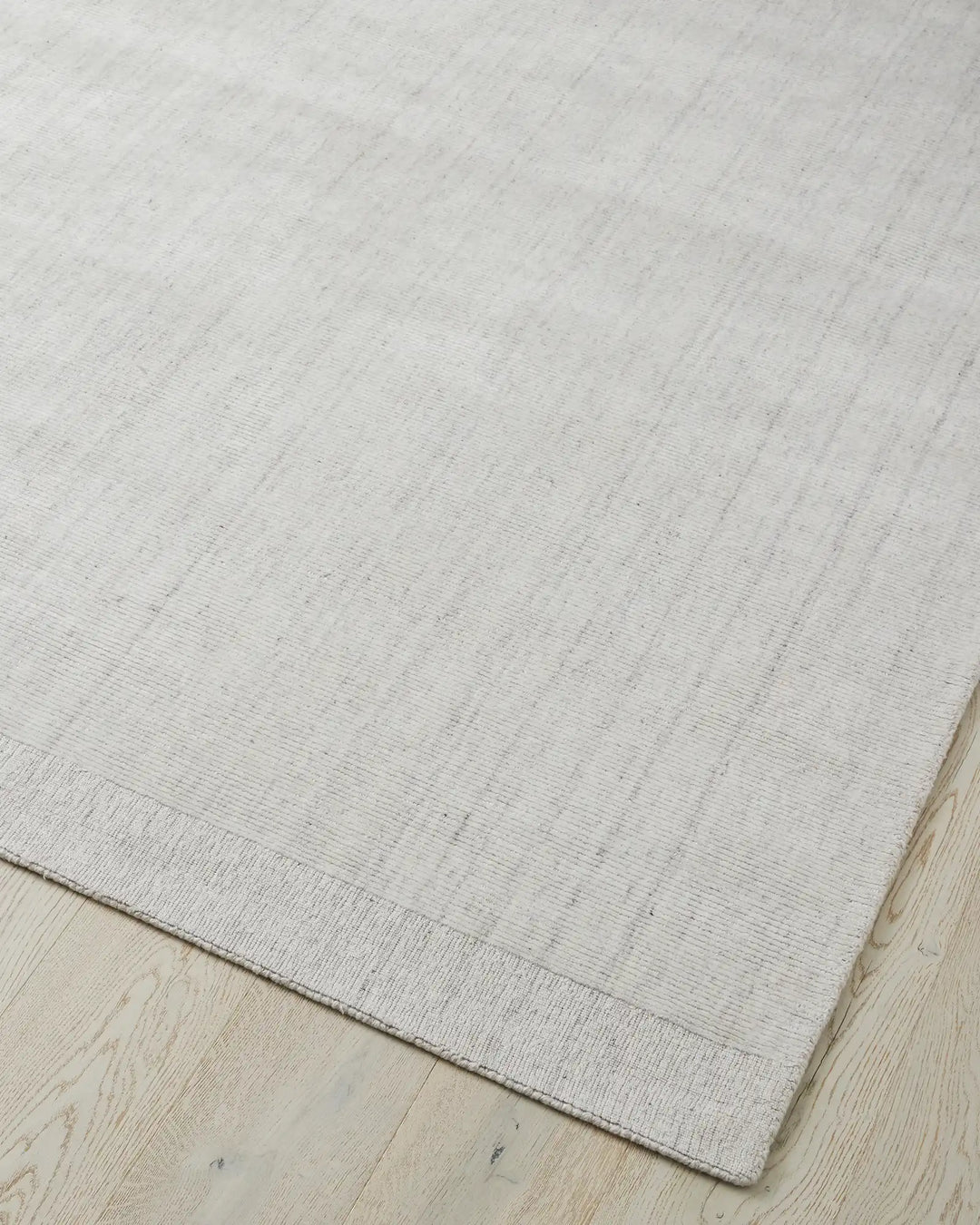 Travertine Marble low-traffic rug, 2m x 3m, viscose blend with hand-woven texture and cotton edging detail by Weave Home
